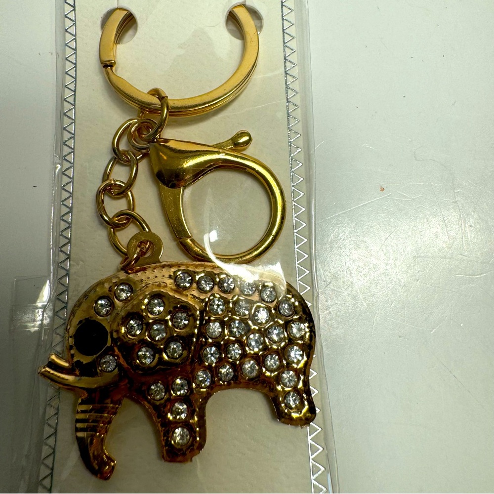 NWT. Gold and rhinestone elephant keychain or bag charm with lobster claw clasp.